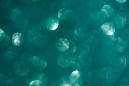 Abstract biscay turquoise green aquamarine defocused bokeh glitter sparkle confetti burst...