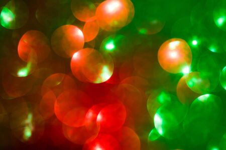 Abstract bokeh multi colors sparkles, Festive Christmas sparkling lights bokeh background. Yellow,...