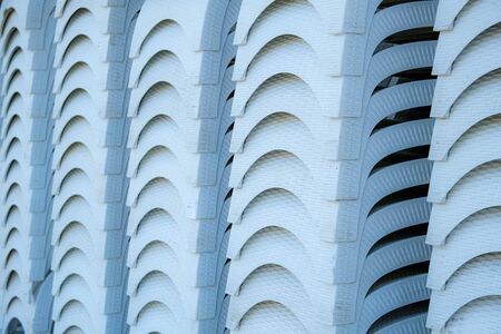 Stack of a sun loungers on the beach. End of summer season. Abstract background.の写真素材