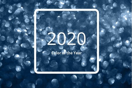 Abstract blue defocused bokeh glitter sparkle confetti burst background. Festive concept. Frame with...