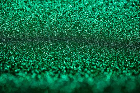 Abstract biscay turquoise green aquamarine defocused bokeh glitter sparkle confetti burst background. Festive concept.の写真素材