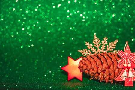 Defocused golden and red Christmas decorations on chive green background.の写真素材