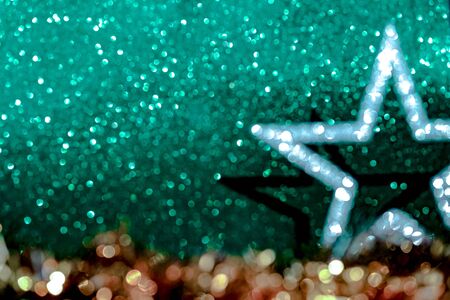Defocused Christmas decorations on biscay turquoise green background.の写真素材