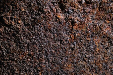 Structure of colourful orange, red and brown hue rusty iron tubes