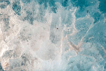 texture of thick blue ckracked ice on the lake, Natural spring or winter background.の写真素材