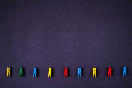 Different colored wooden clothes pegsの写真素材