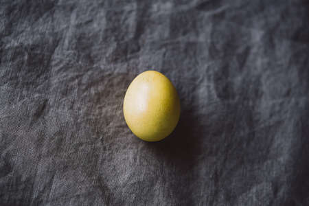 Organic naturally dyed yellow and gray Easter eggs. Stylish holiday home decor.