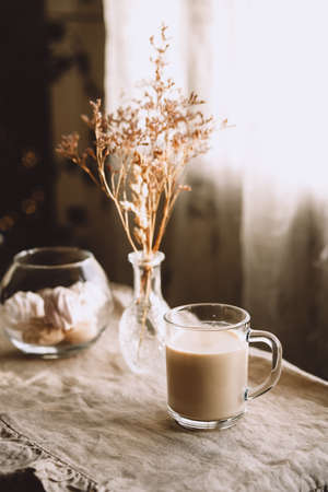 Morning coffee in pastel beige tones. Inviting kitchen.の写真素材
