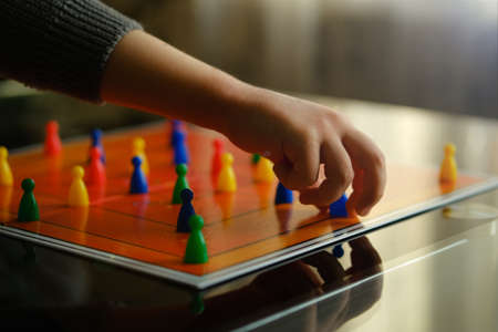 Childs Hands close up. Board games concept.の写真素材