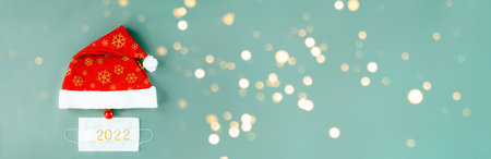 Santa Christmas Hat and Medical mask. New Year Flat Lay.の写真素材