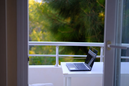 laptop computer on the balcony. Home office concept.
