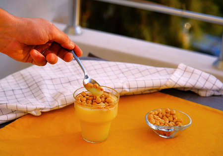 Boza or bosa, bozo, traditional Turkish beverage with leblebi. Malt drink made by fermenting maize...