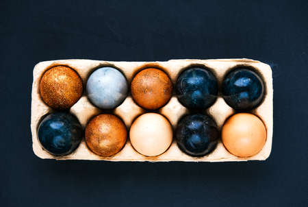 Dark blue Easter eggs on gray backgroundの写真素材