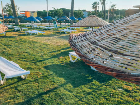 Bamboo beach umbrella on blue sky backgroundの写真素材