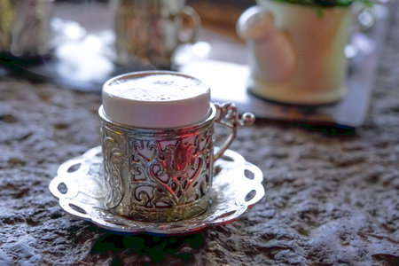 Copper cups with Turkish coffee cooked in hot sand.の写真素材