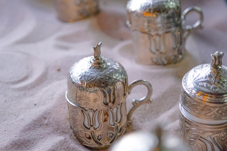 Copper cups with Turkish coffee cooked in hot sand.の写真素材