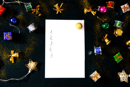 Blank sheet of paper and Christmas decorations. List of goals.の写真素材