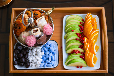 Tray of sweets and fruit served for tea.の写真素材