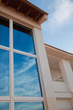 reflections in the glass of a buildingの写真素材