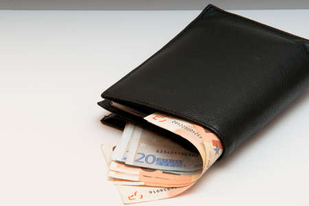 the photo is a wallet with money sticking out, the iimagine may Represent an expense, or the value...