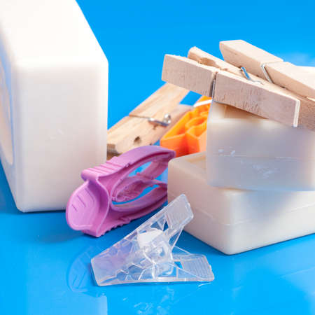 soap and clothespins put on a clean a light blue backgroundの写真素材