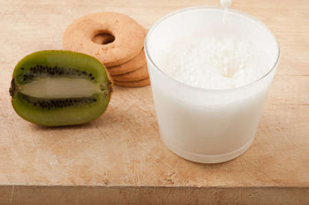 Breakfast with milk and cookies and kiwiの写真素材