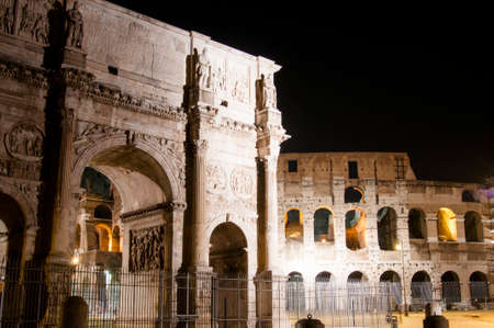 Colosseum and Arch of Constantine at nightの写真素材