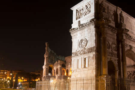 Colosseum and Arch of Constantine at nightの写真素材