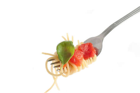 Spaghetti with fresh tomato rolled on fork. Traditional Italian Foodの写真素材