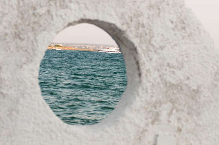 Panoramic view from a porthole of Porto Cesareo Puglia. Italyの写真素材