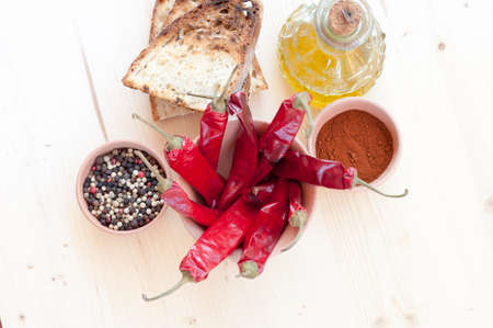 red chillies, oil, bread and pepper in a jar of clay