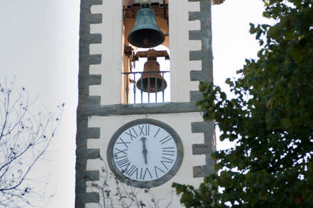ancient bell tower of a church with clock