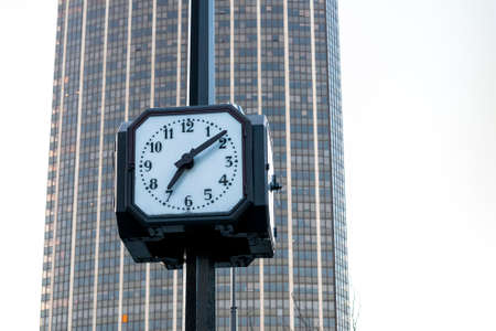 Close up of a clock with the background the tower montparnasseの写真素材