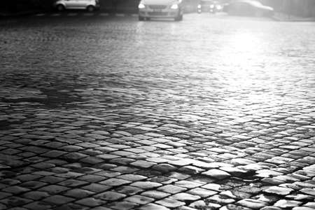 sanpietrini backlighting, typical pavement of the road in Italy