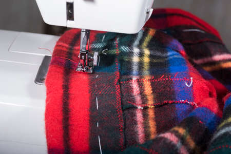 view of a tailored suit from a tailor in his studio.
