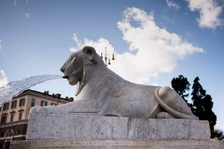 beautiful fountain shaped like a lion in Piazza del Popolo.の写真素材