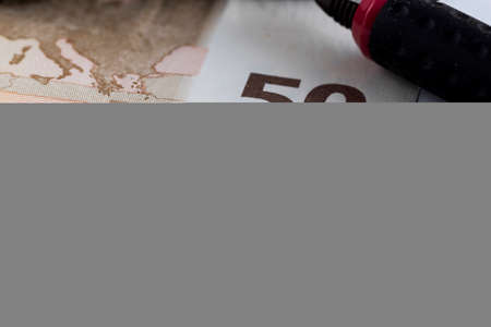Fifty Euro Banknote in a macro shot, with below chart and sheet accountsの写真素材