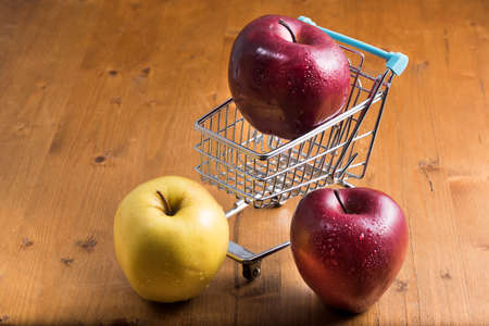 go shopping and buy red and yellow applesの写真素材