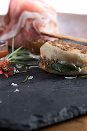 the tigella is a dish very very typical of Emilia, Italy region. It is stuffed with sauces and vegetables and pork cutsの写真素材
