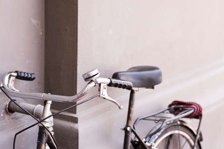 vintage bicycle with wicker basket placed on a wall .Firenze