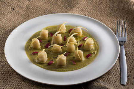 velvety green peas with dumpling, lemon and radicchioの写真素材