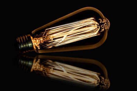 bulb vintage hydrocarbons, with reflection on black backgroundの写真素材