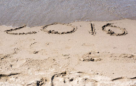 written on the sand year 2016 concept for new year greeting cards and calendarsの写真素材
