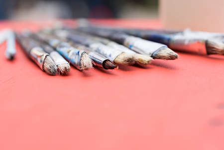 paints and brushes used to paint a pictureの写真素材