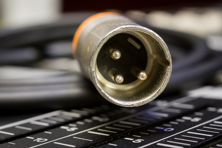 Orange Analog Audio Instrument Lead connector on Digital mixing consoleの写真素材