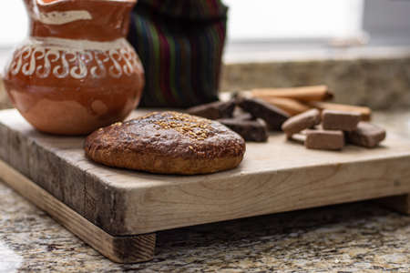 Traditional mexican bread served with organic cocoa chocolateの写真素材