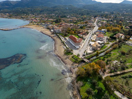 Aerial view of a coastal town with turquoise waters and sandy beach.の写真素材