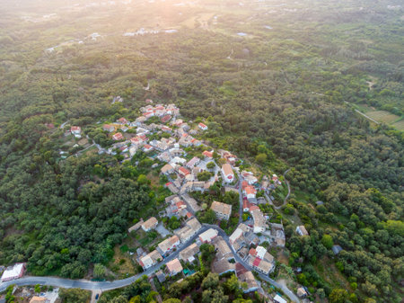 Aerial view of a quaint village nestled amidst a lush green landscape.の写真素材
