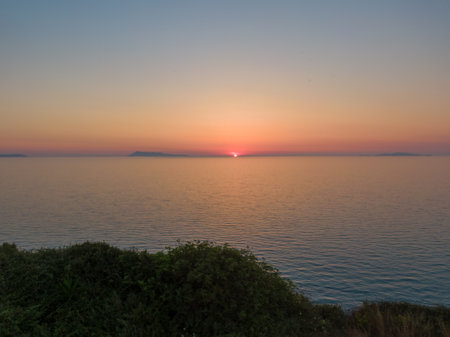 Sunset over Calm Oceanの写真素材