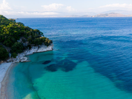 Tranquil turquoise cove meets deep blue sea.の写真素材
